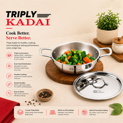 Stainless steel Triply Kadai with vegetables on a wooden board, surrounded by kitchen items. Four Brothers Triply Tasla for Cooking Curries, Gravies and Rice