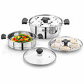 Trio 3-tier stainless steel steamer with glass lid, stacked steaming compartments, and handles.