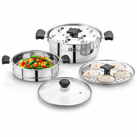Trio 3-tier stainless steel steamer with glass lid, stacked steaming compartments, and handles.